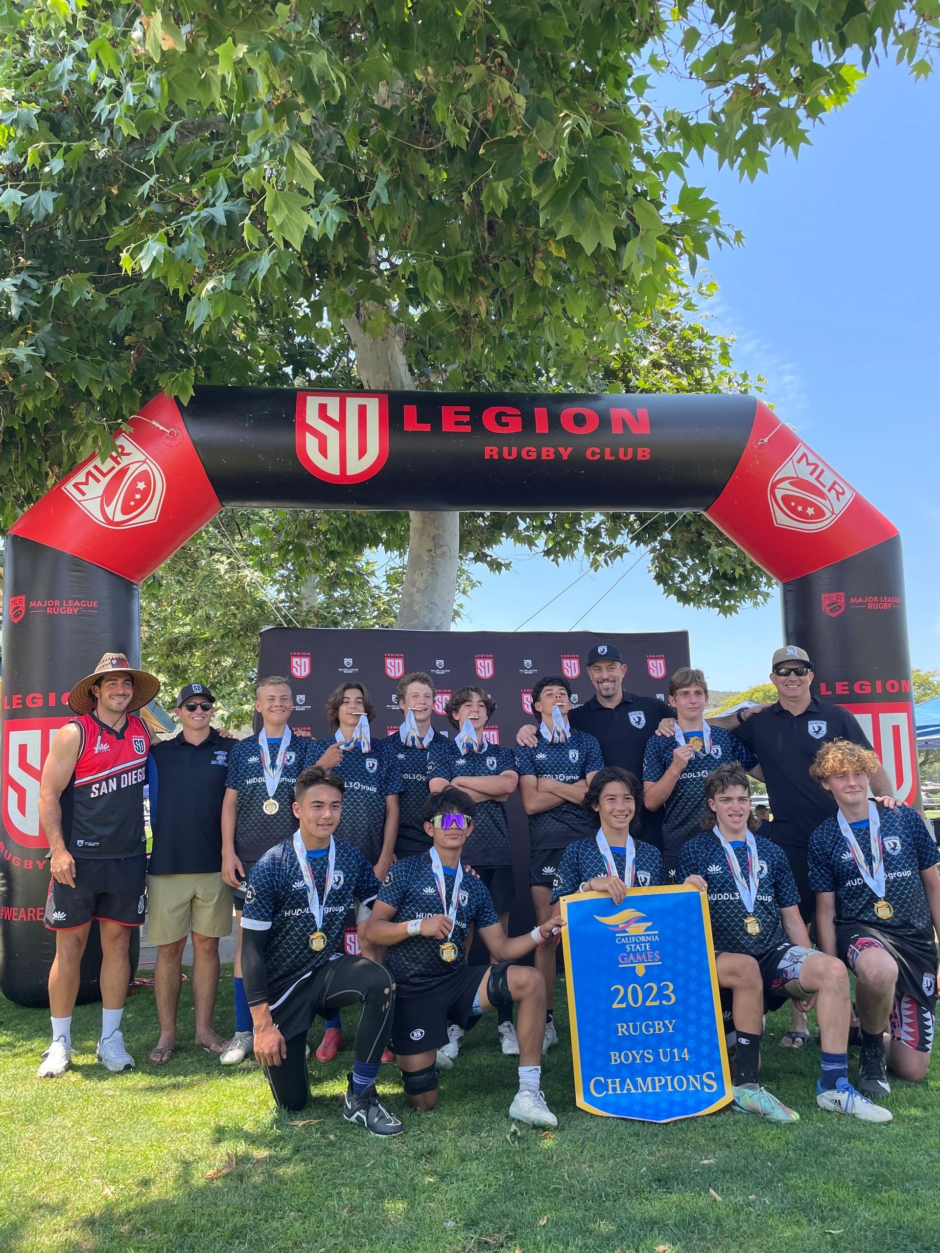 Raptors rugby team huddle with coach
