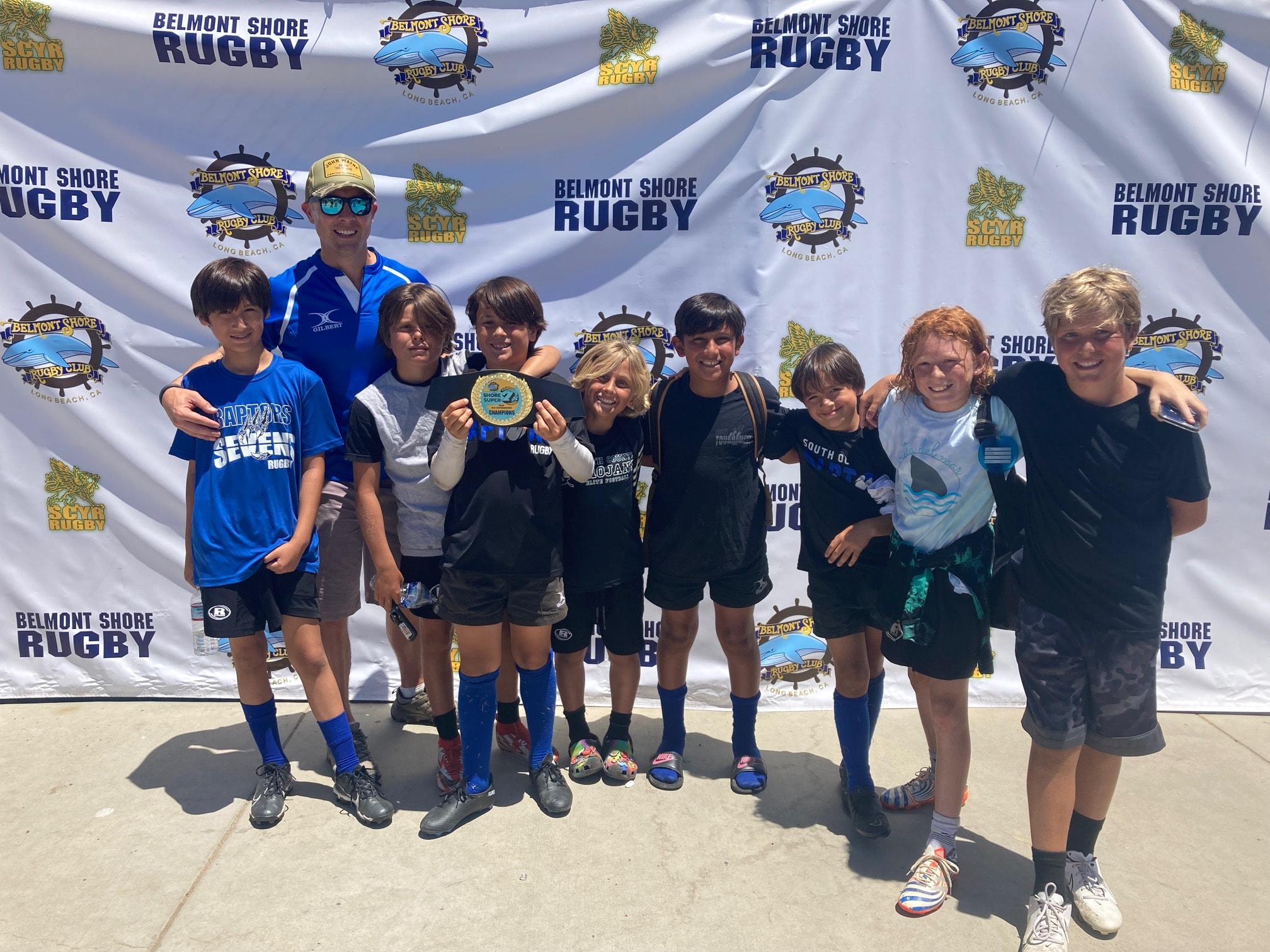 Raptors youth players celebrating at Belmont Shore Rugby tournament